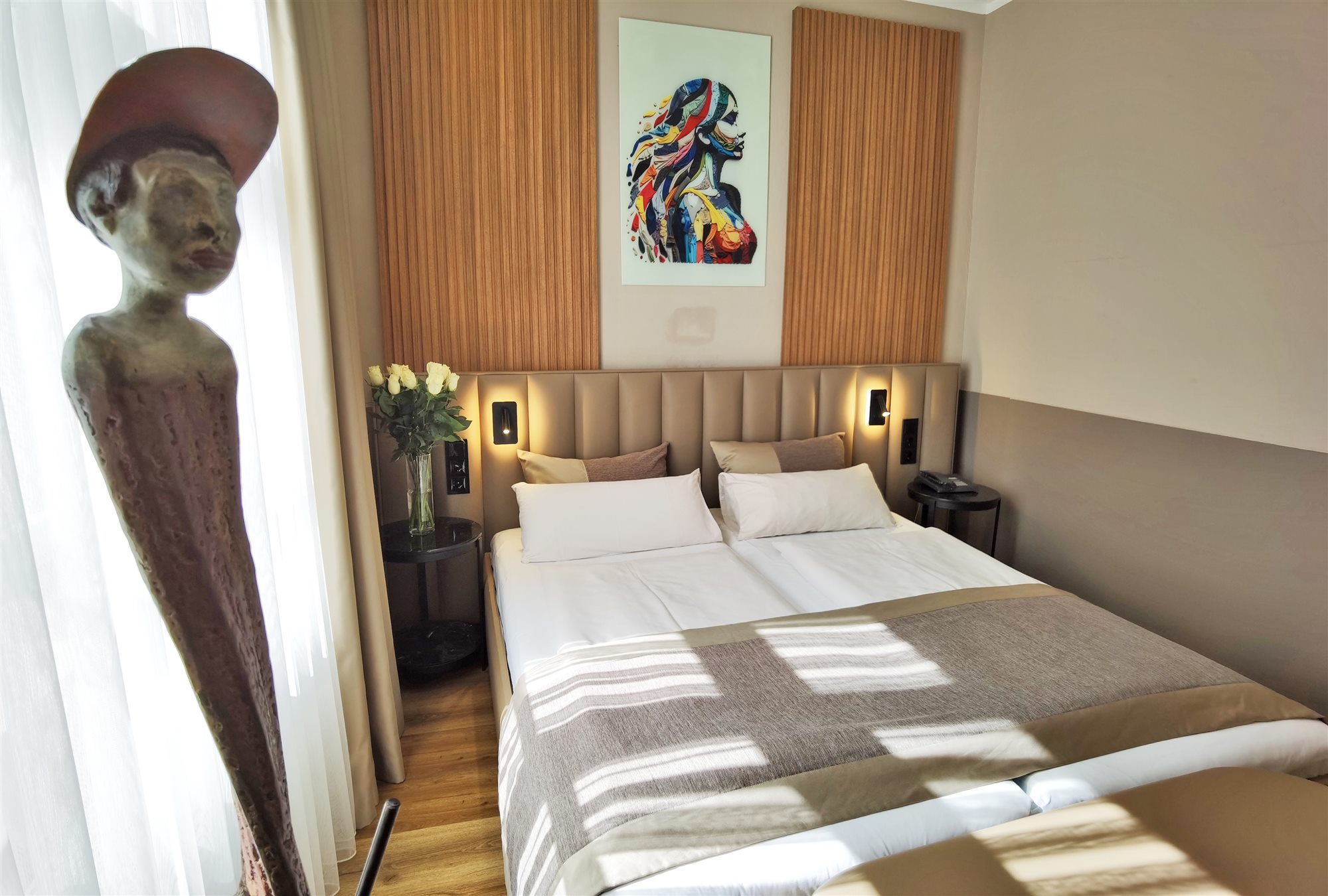Guest room with colourful artwork